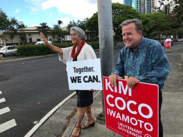 Kim and Hooser holding signs